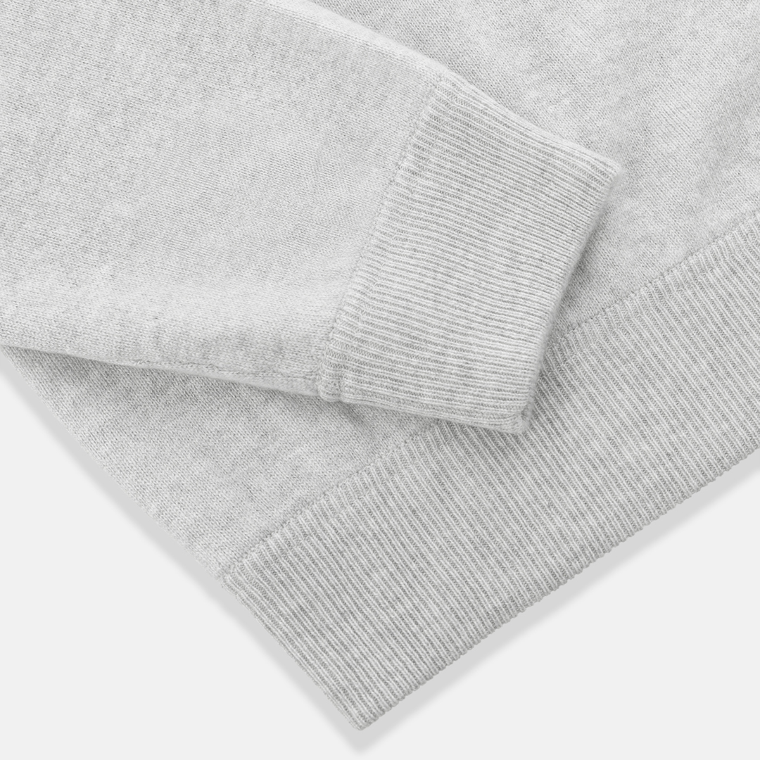 Sleeve and texture detail of Subellotti Luno Cashmere Crewneck in Ghiaccio Grey