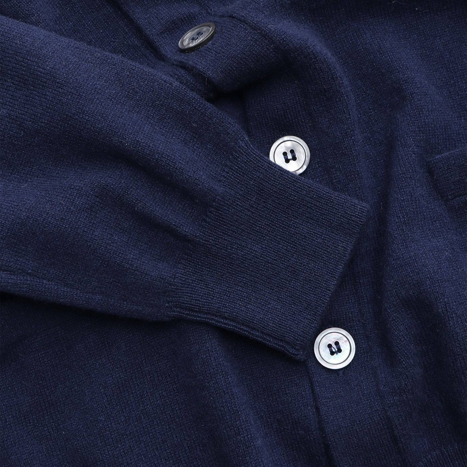 Lugano Cardigan Navy — button and collar detail