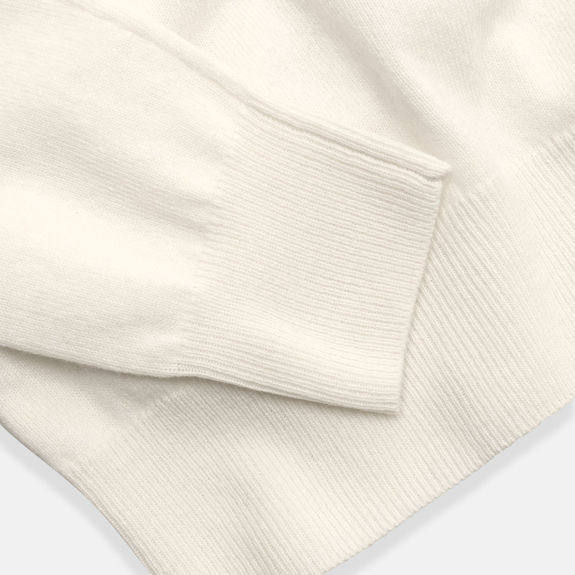 Napolitano Turtleneck Milk — ribbed cuff and hem detail